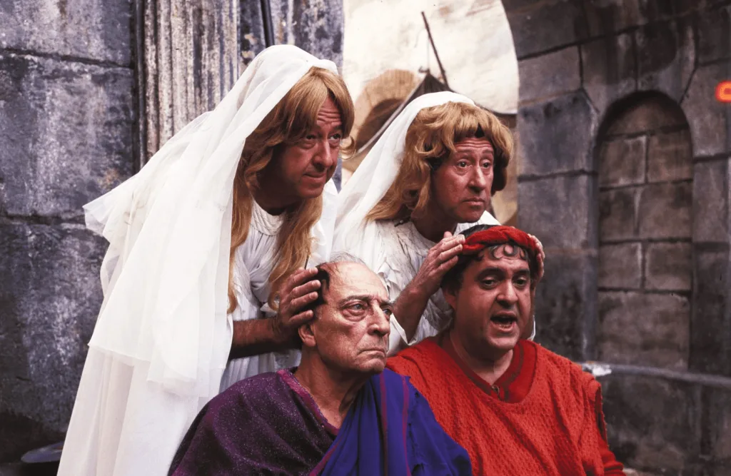 Film image illustrating how 1960s musicals used style and comedy to critique contemporary culture.