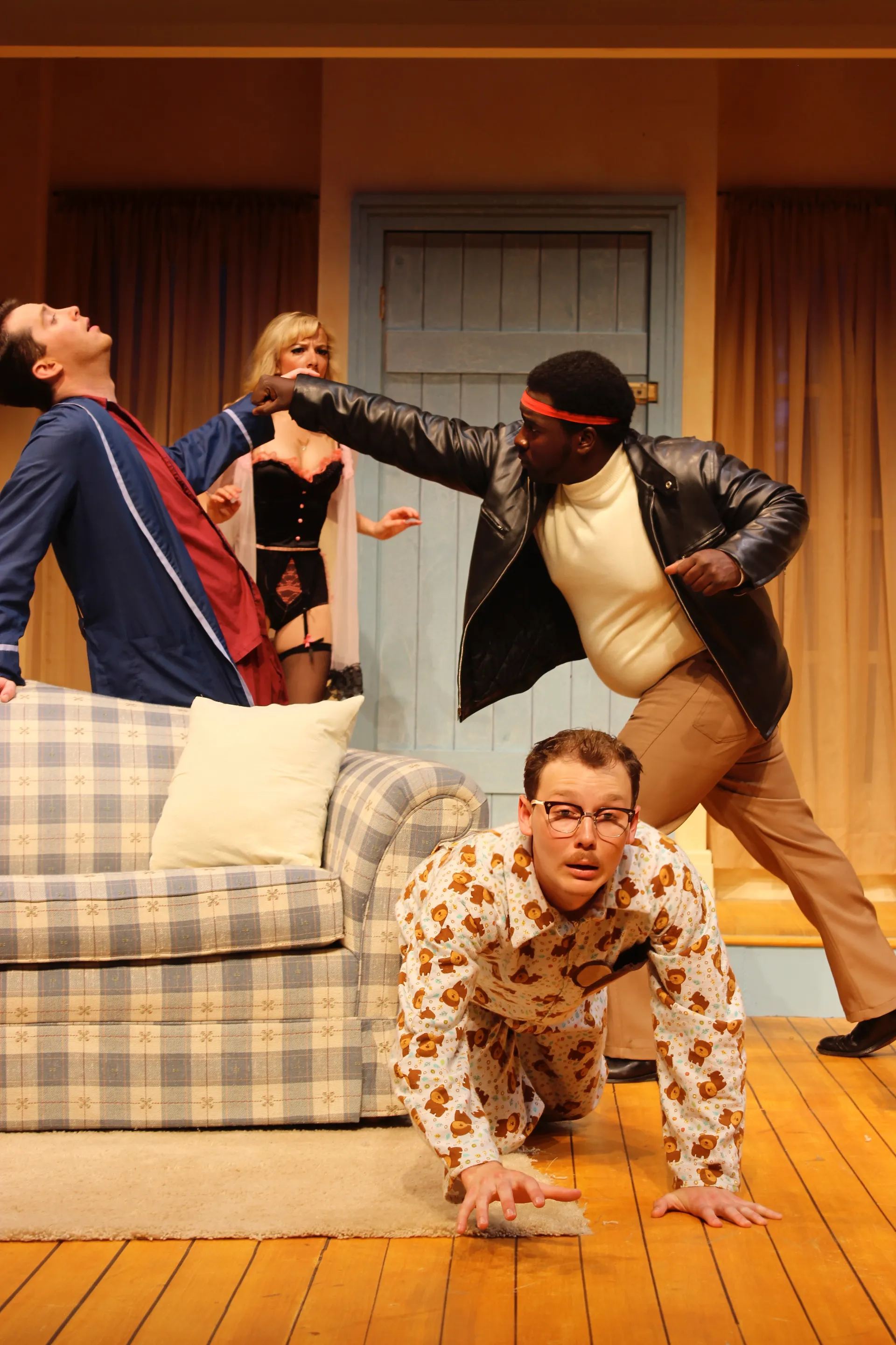 Production still from Don't Dress for Dinner showing the farmhouse interior as romantic setting and comic engine, scenic design by Brandon PT Davis.