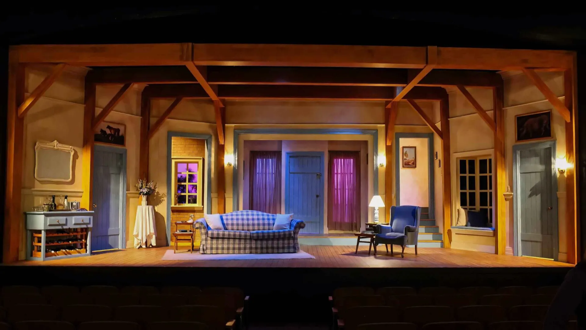 Production image from Don't Dress for Dinner showing the restored French farmhouse environment, scenic design by Brandon PT Davis.