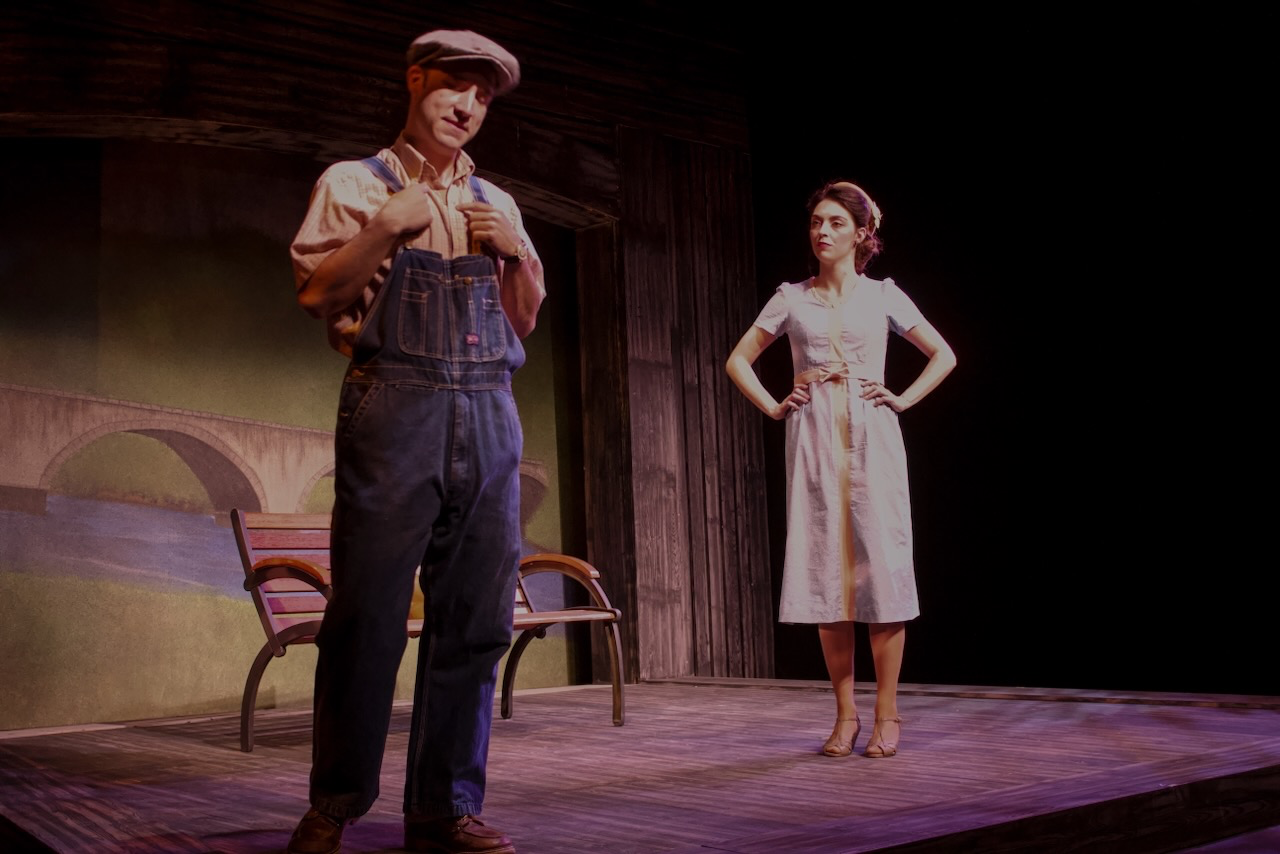 Production image from Last Train to Nibroc highlighting the compressed proscenium and warm material palette, scenic design by Brandon PT Davis.