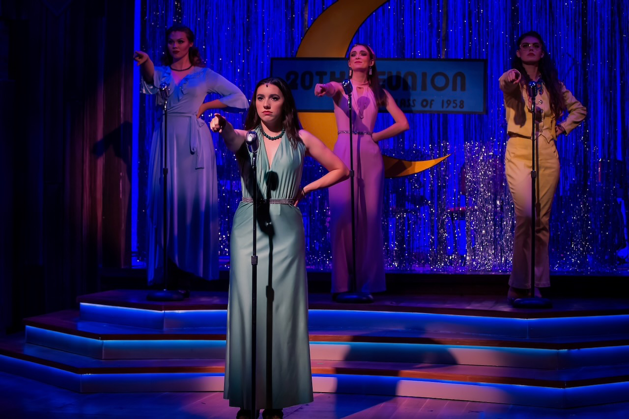 Performance image from The Marvelous Wonderettes: Dream On with the reunion stage and period details visible, scenic design by Brandon PT Davis.