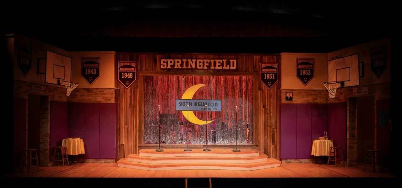 Production image from The Marvelous Wonderettes: Dream On showing the warmer later-decade palette and reunion staging, scenic design by Brandon PT Davis.