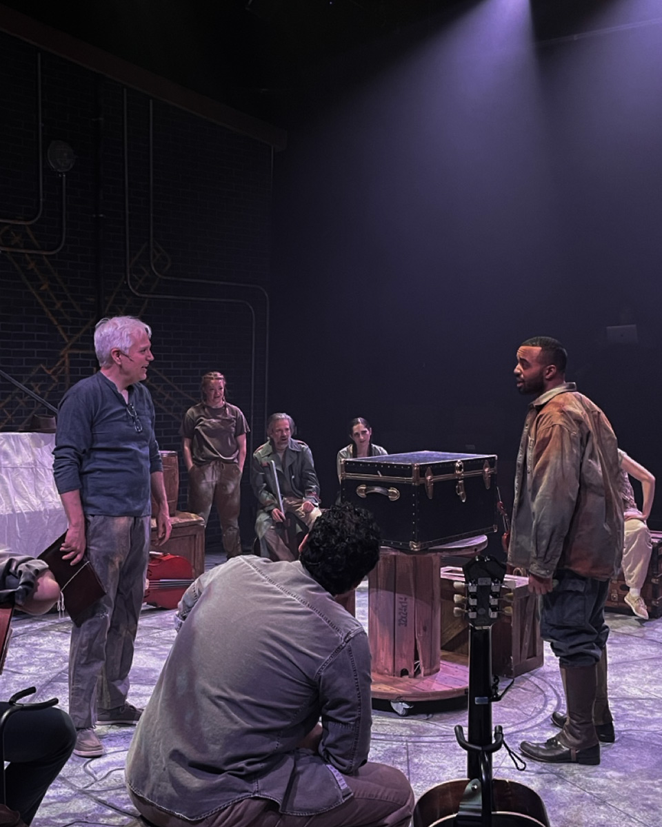 Performance image from The Man of La Mancha centered in the circular ritual floor pattern, scenic design by Brandon PT Davis.