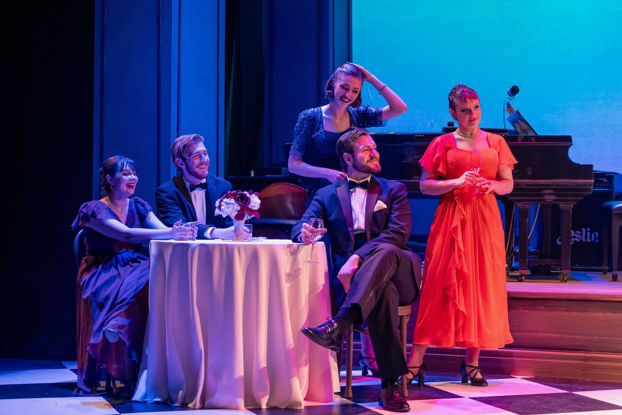 Scene from Cole framed by the cabaret environment, scenic design by Brandon PT Davis.