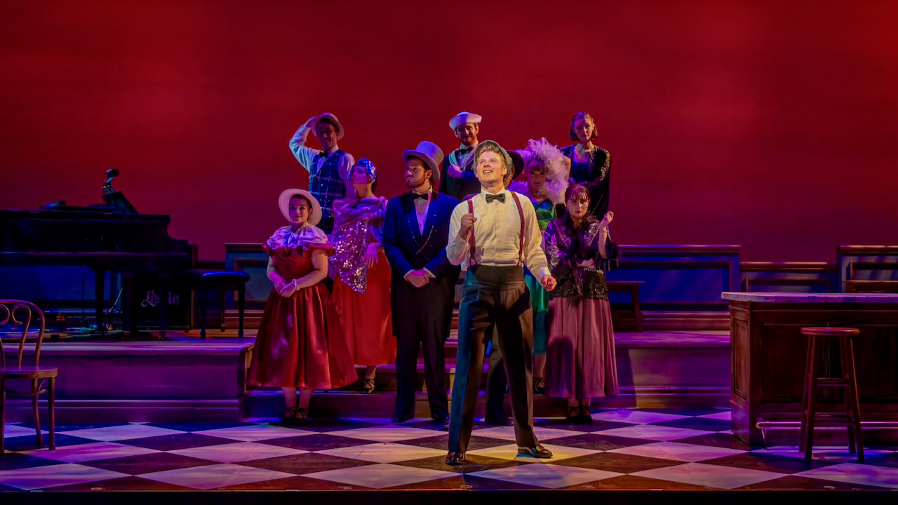 Production image from Cole showing the jazz-age room and bar, scenic design by Brandon PT Davis.