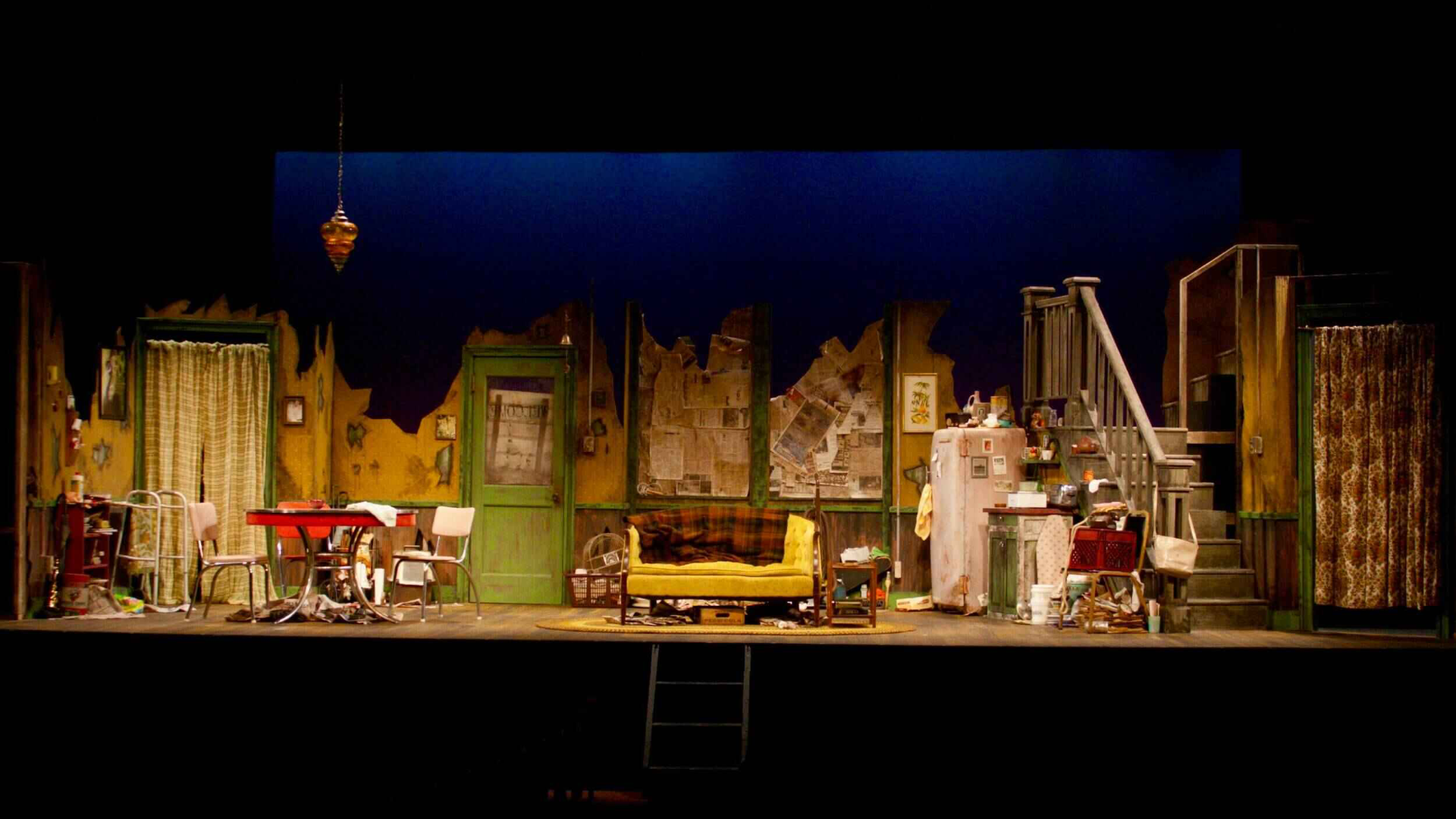 Production still from The Effect of Gamma Rays on Man-in-the-Moon Marigolds showing the brittle interior surfaces and compressed space, scenic design by Brandon PT Davis.