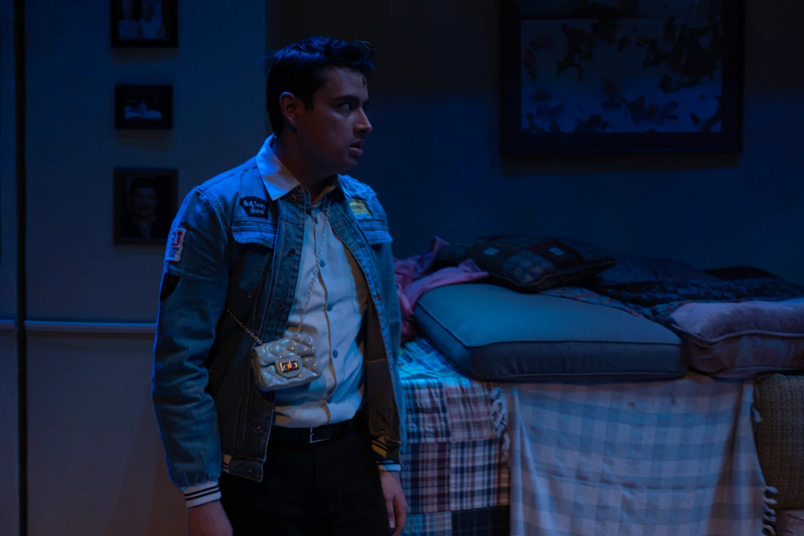 Stage image from ¡LOTERIA: GAME ON! featuring actors within the modular basement set, scenic design by Brandon PT Davis.