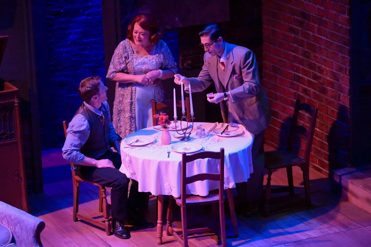 Performance moment centered in the fragile interior world of The Glass Menagerie, scenic design by Brandon PT Davis.