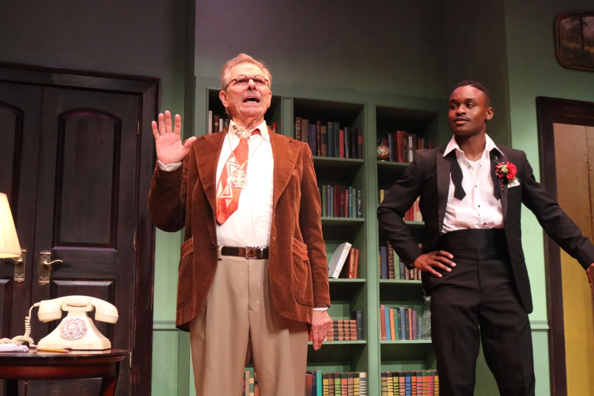 Performance image from Bell, Book, and Candle within the grounded interior setting, scenic design by Brandon PT Davis.