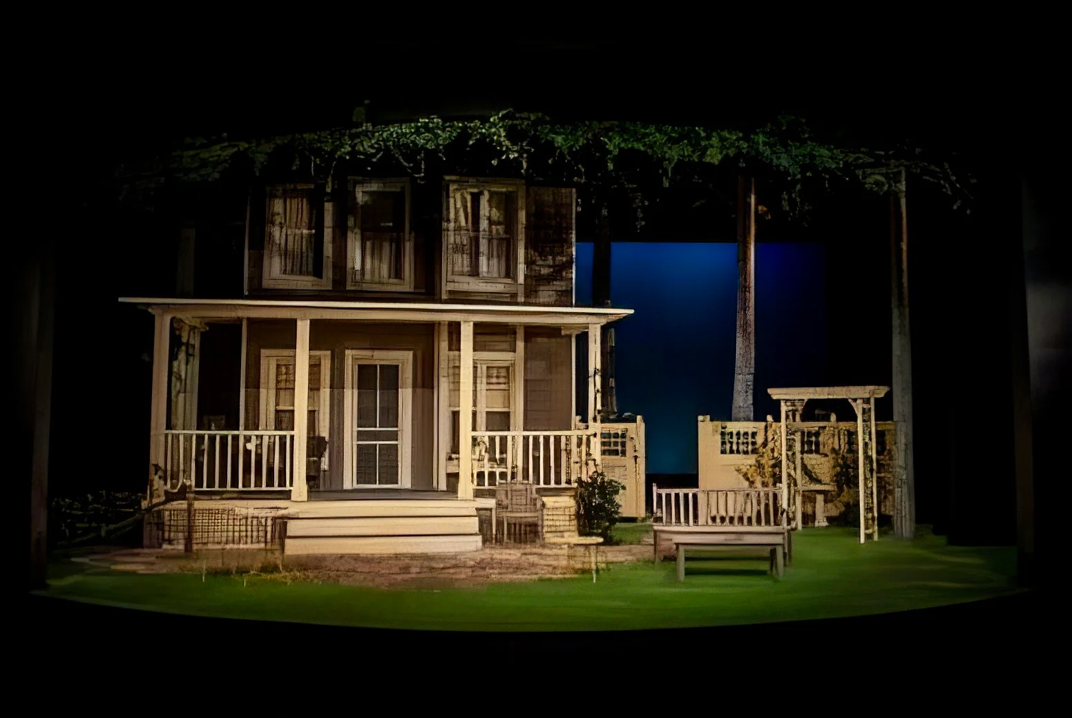 Production image from All My Sons showing the postwar suburban house and yard, scenic design by Brandon PT Davis.
