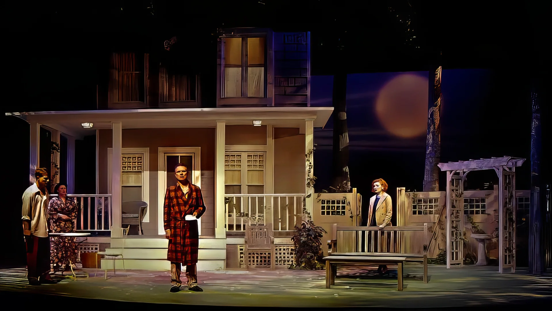 Production image from All My Sons highlighting the open porch and domestic realism, scenic design by Brandon PT Davis.