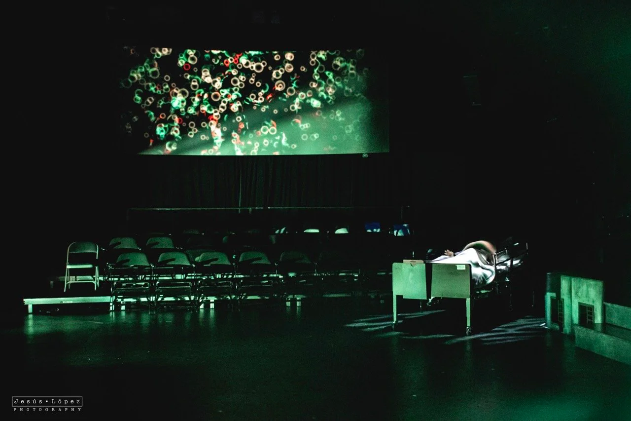 Production image from Parliament Square showing the circular stone path and sparse political landscape, scenic design by Brandon PT Davis.