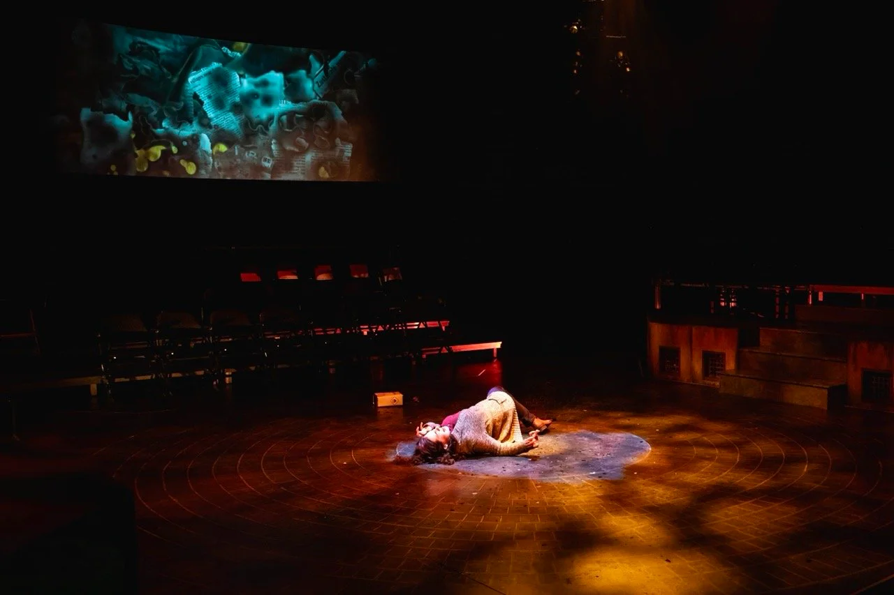 Production image from Parliament Square highlighting the ritual staging geometry and fractured environment, scenic design by Brandon PT Davis.