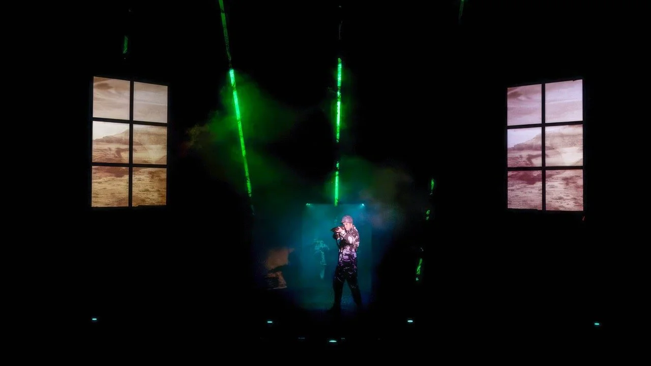 Production still from American Idiot showing industrial forms and the show's kinetic physicality, scenic design by Brandon PT Davis.