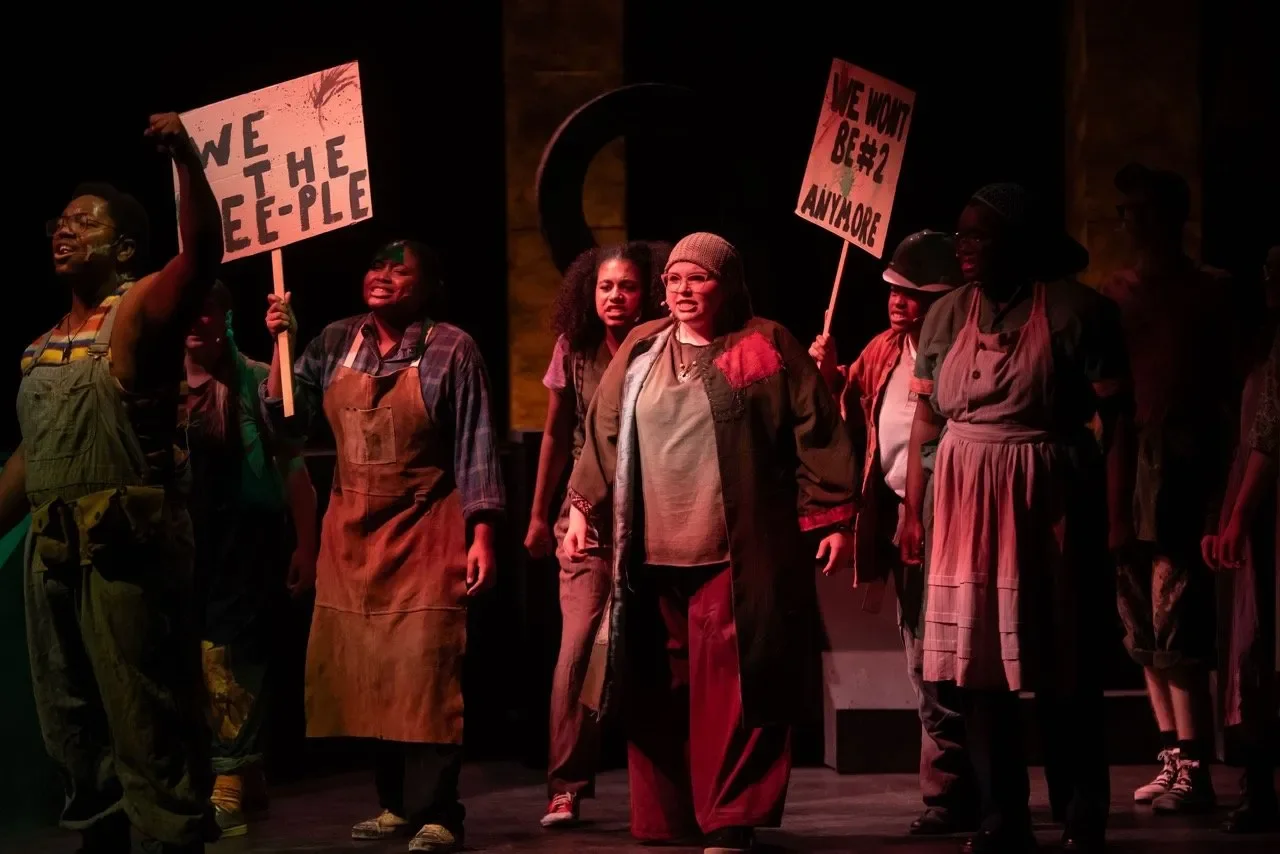 Production image of Urinetown at University of Missouri with the full scenic footprint, scenic design by Brandon PT Davis.