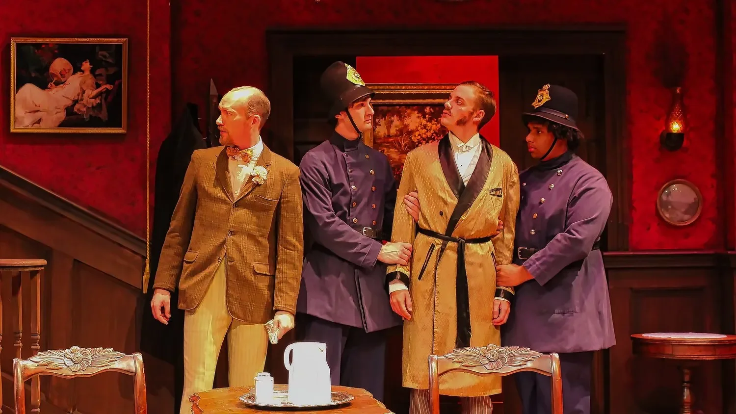 Production image from Angel Street showing the Victorian drawing room and formal architecture, scenic design by Brandon PT Davis.