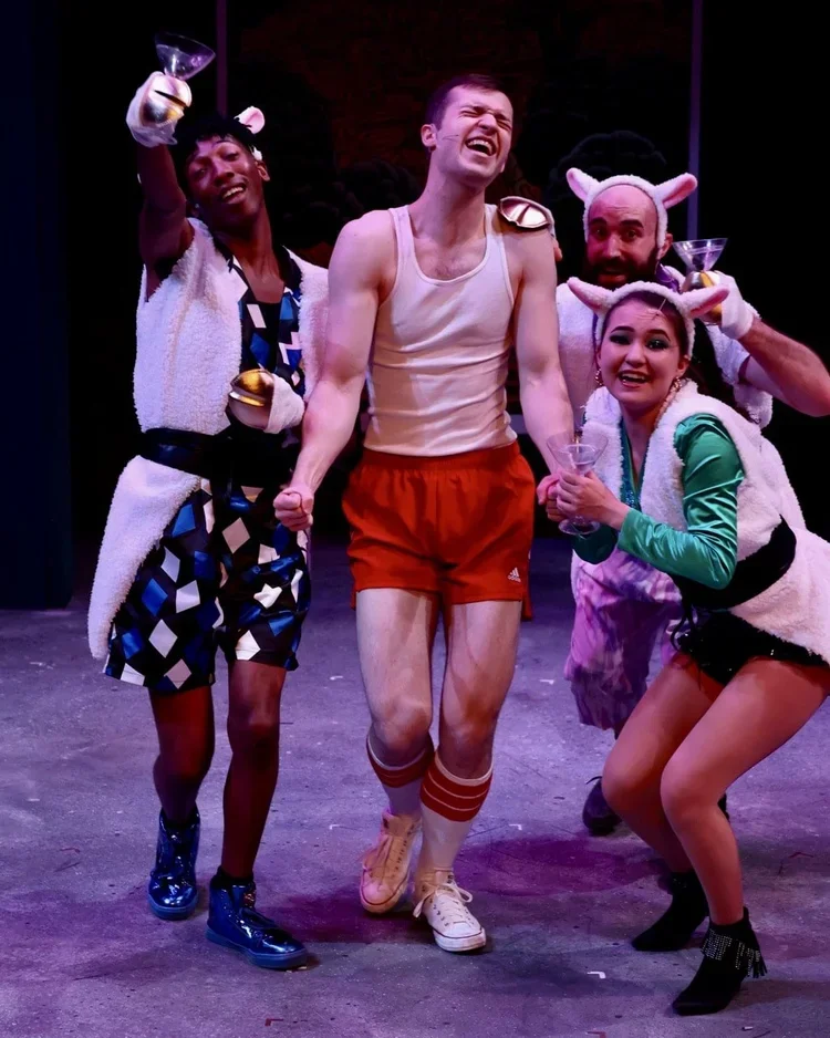 Scene from Head Over Heels framed by vivid color and stylized architecture, scenic design by Brandon PT Davis.