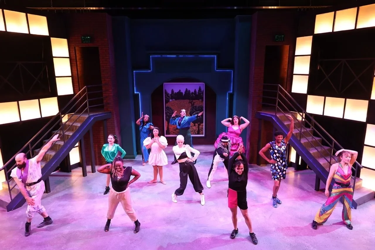 Production image from Head Over Heels highlighting electric palette and theatrical rhythm, scenic design by Brandon PT Davis.