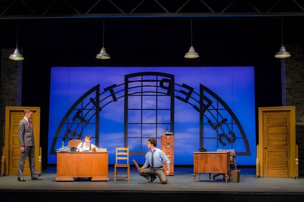 Production image from The Pajama Game emphasizing the graphic factory environment and choreography space, scenic design by Brandon PT Davis.