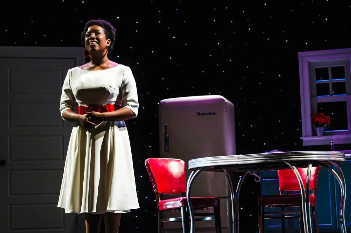 Production image from The Pajama Game showing scenic rhythm during a large musical number, scenic design by Brandon PT Davis.
