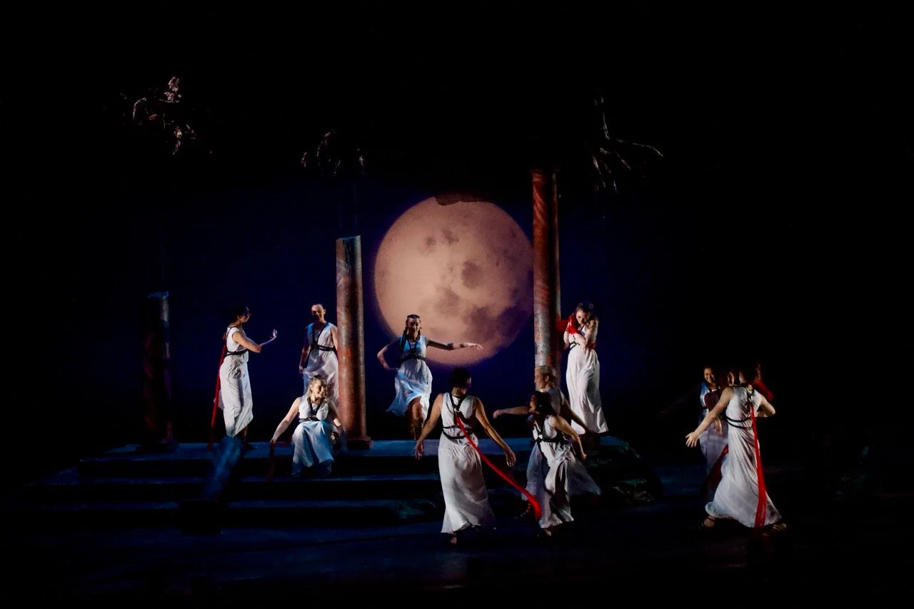 Production image from The Penelopiad showing the ritual scenic environment and chorus staging, scenic design by Brandon PT Davis.