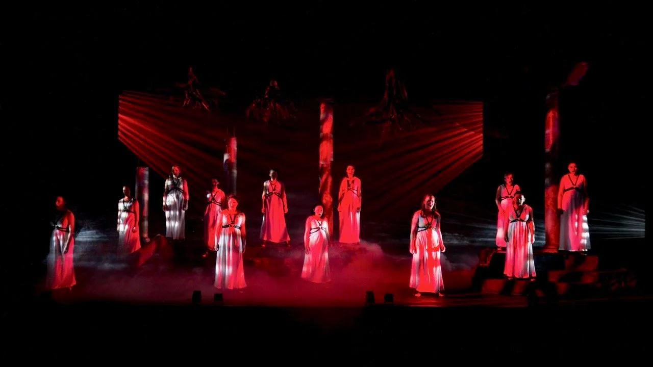 Production image from The Penelopiad highlighting the layered memory space and ensemble composition, scenic design by Brandon PT Davis.