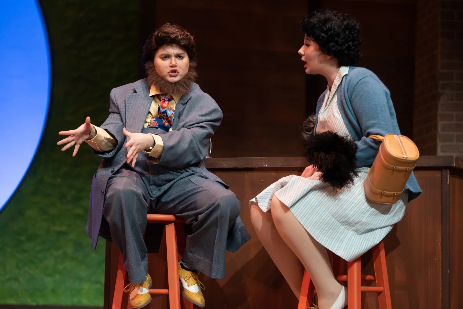 Production still from The Merry Wives of Windsor highlighting doorways, concealment, and comic staging, scenic design by Brandon PT Davis.