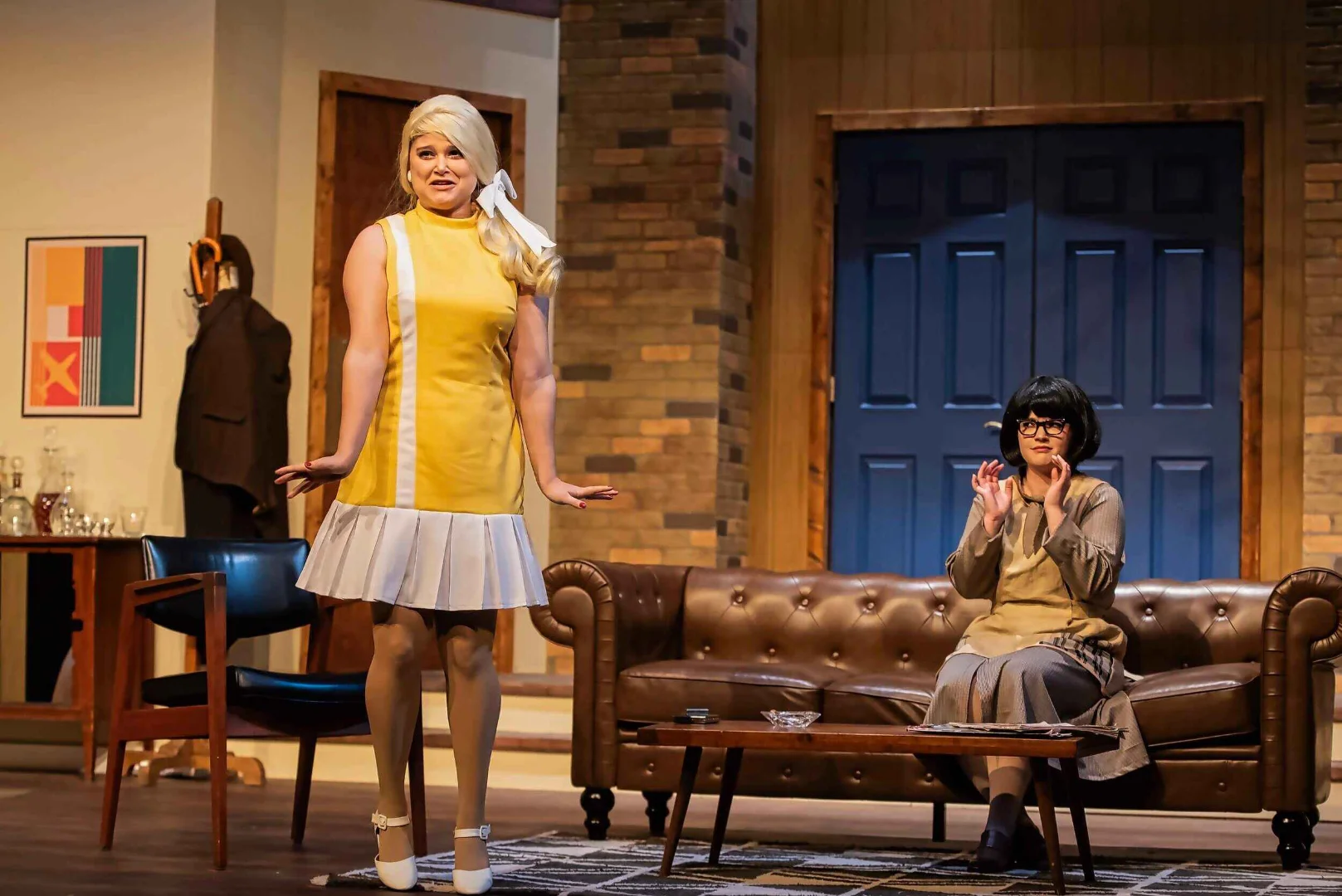 Scene from Boeing, Boeing showing actors moving through the apartment's choreographed doorways, scenic design by Brandon PT Davis.