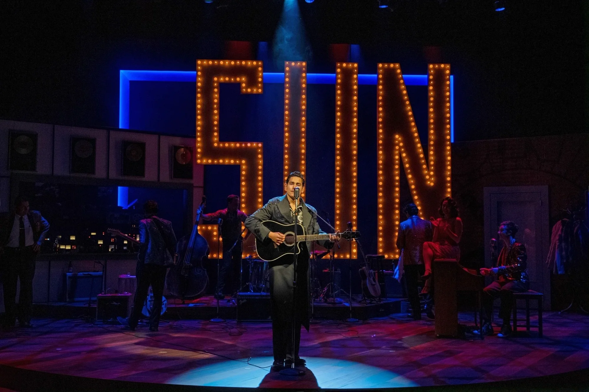 Performance moment on the Sun Records-inspired set for Million Dollar Quartet at South Coast Repertory, scenic design by Brandon PT Davis.