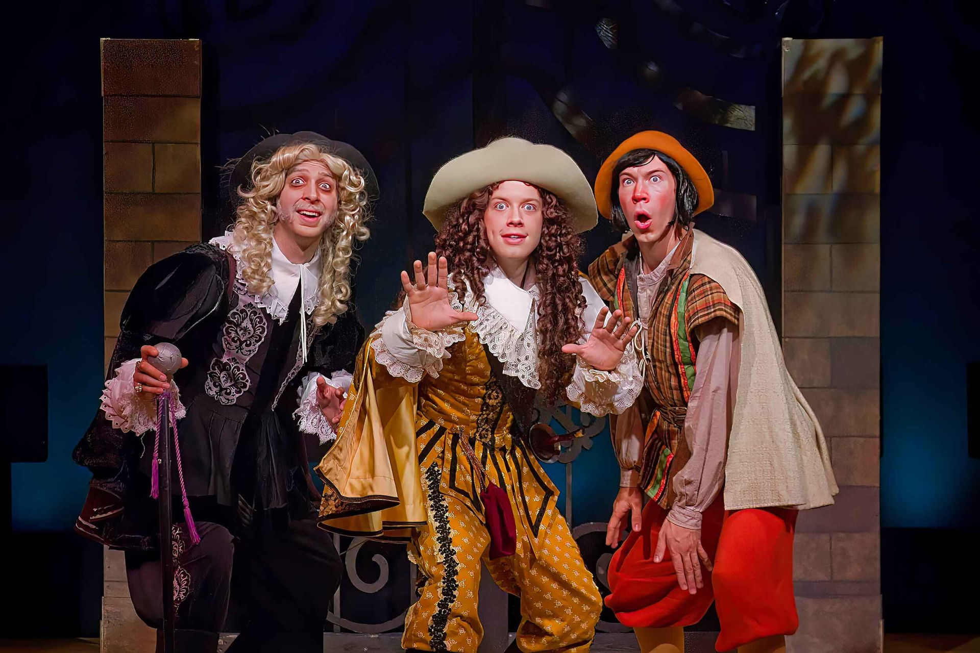 Production image from The Liar showing the classical comic setting and staging, scenic design by Brandon PT Davis.