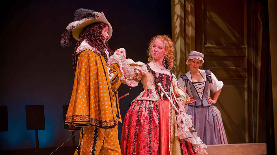 Stage image from The Liar emphasizing wit, movement, and the scenic environment, scenic design by Brandon PT Davis.