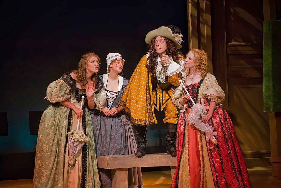 Performance image from The Liar reinforcing the bold visual rhythm of the comic setting, scenic design by Brandon PT Davis.