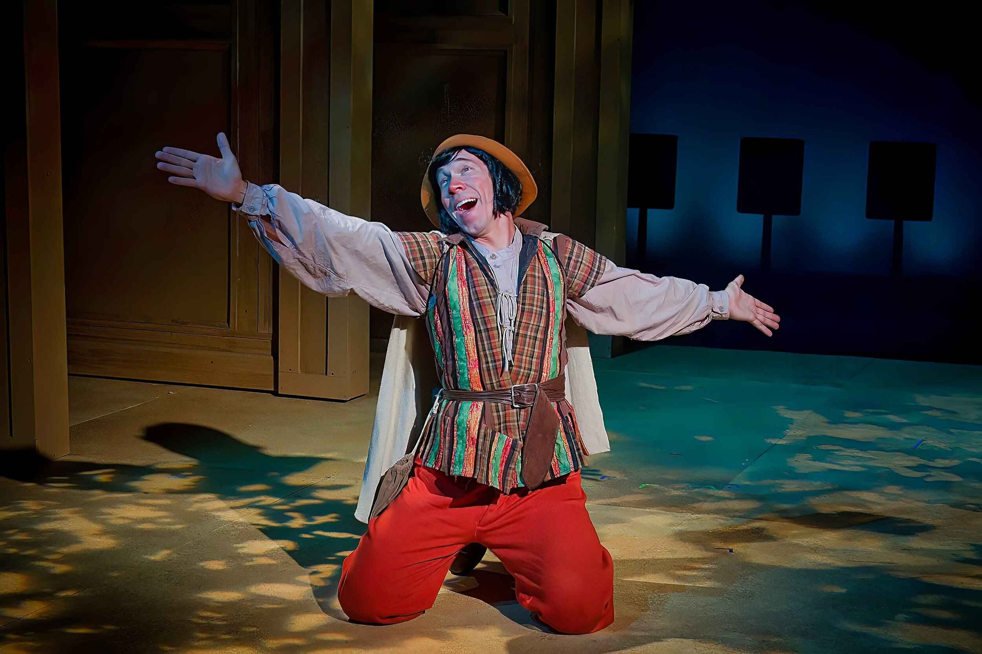 Final production image from The Liar showing the full comic environment, scenic design by Brandon PT Davis.