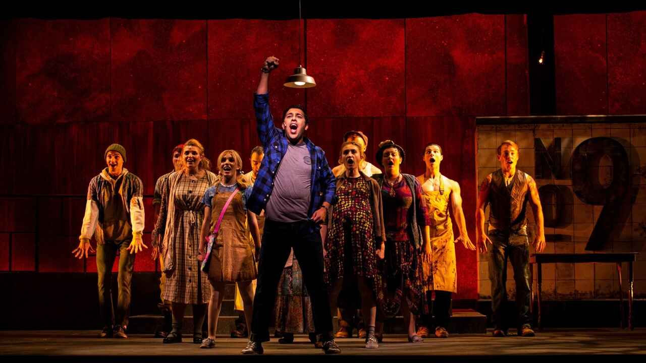 Production image from the 2021 Urinetown highlighting concrete texture and dystopian atmosphere, scenic design by Brandon PT Davis.
