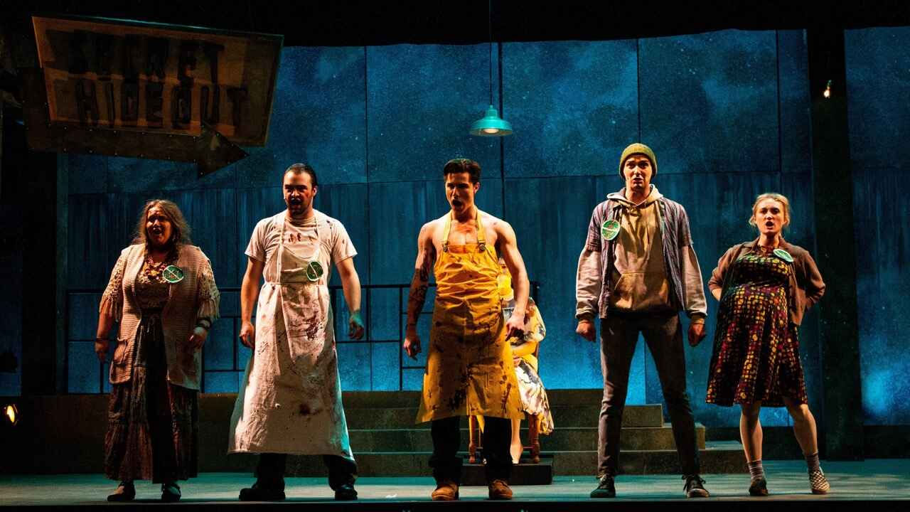 Production image from the 2021 Urinetown showing the angular dystopian environment, scenic design by Brandon PT Davis.
